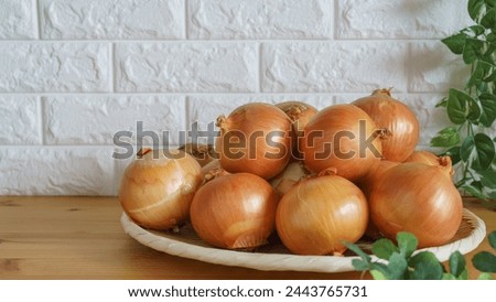 Onions on a bamboo basket.