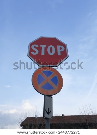 Regulatory stop and no parking and no stopping traffic sign