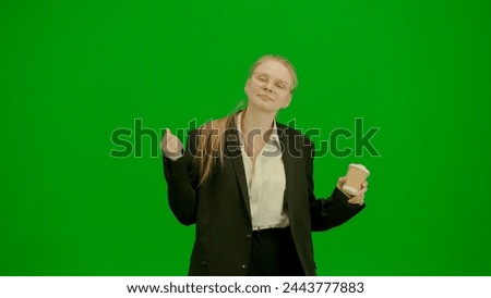 Women in business suit on green screen with chroma key. Blonde business woman with paper cup with coffee in hand.