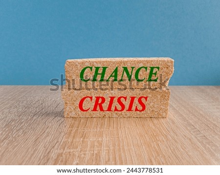 Brick blocks with words Crisis and Chance. Beautiful blue background, wooden table. Mindset is important for human development concept. Copy space.