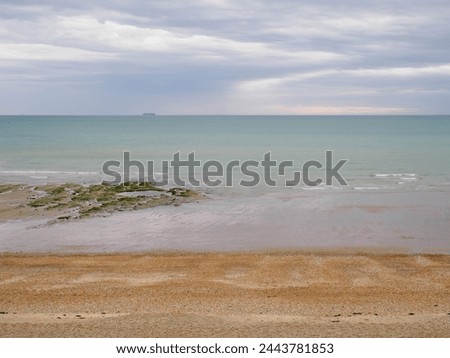 Seascape with dramtic sky. The sea coast between Audresselles and Ambleteuse. Waters of the English Channel - The La Manche Channel. France.