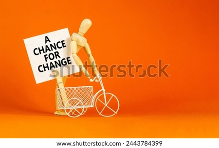 A chance for change symbol. Concept words A chance for change on beautiful white paper on clothespin. Voter model. Beautiful orange background. Business A chance for change concept. Copy space.