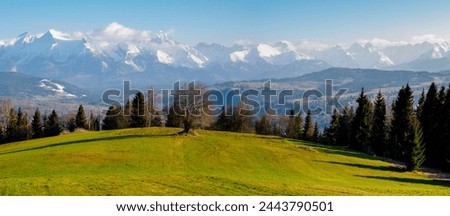 Mountains Landscape in winter. Tatra National Park- view from Czarna Gora. Spisz. Malopolskie. Poland. A meadow in the foreground. Focus on all planes. Panoramic photography.