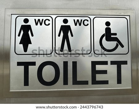 WC and Toilet sign on the wall on the public toilet