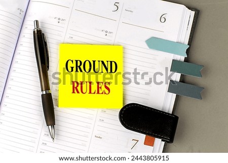 GROUND RULES text sticky on dairy on a gray background.