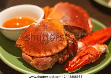 Top down view of a plate of brown crabs or cancer pagurus. Focus on front crab. Tsim Sha Tsui, Hong Kong Royalty-Free Stock Photo #2443808955