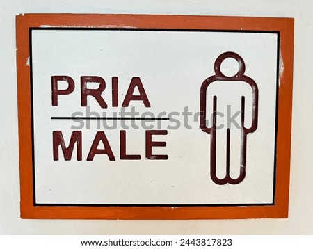 Nice male toilet sign on the wall