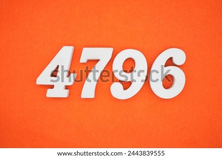 Orange felt is the background. The numbers 4796 are made from white painted wood.