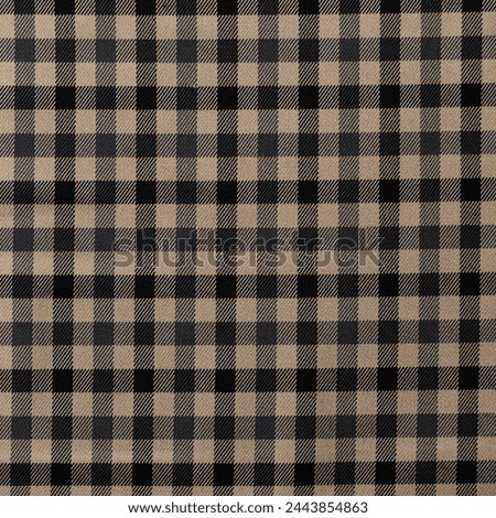 Tartan plaid. Scottish pattern in black, brown and white cage. Scottish cage. Traditional Scottish checkered background. Seamless fabric texture
