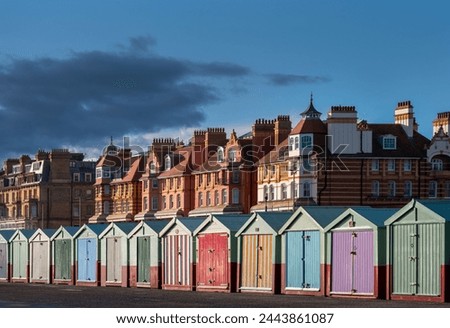 Beach huts on Hove promenade on a spring afternoon, South East England Royalty-Free Stock Photo #2443861087
