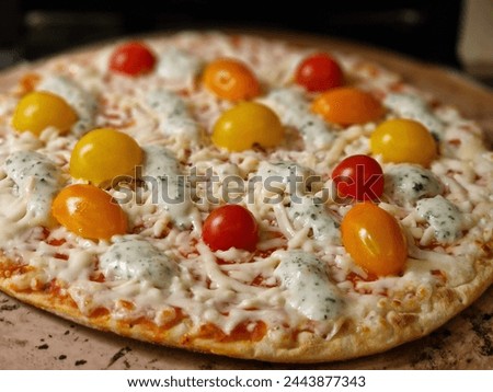 Mouthwatering Homemade Pizza Fresh Out of the Oven. Perfectly Melted Cheese, Juicy Tomatoes, and Savory Sausage Toppings. The Ultimate Comfort Food Delight.