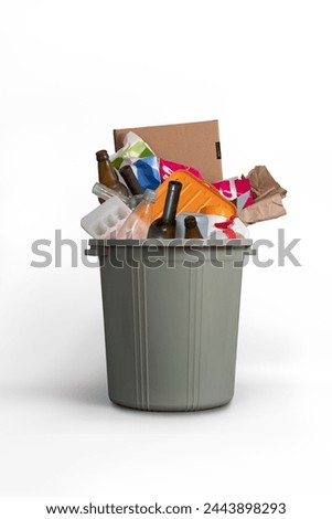 Trashcans, unsorted waste in plastic trash bins Royalty-Free Stock Photo #2443898293
