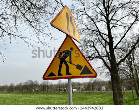 Under Construction Sign, road repair sign on sky background
