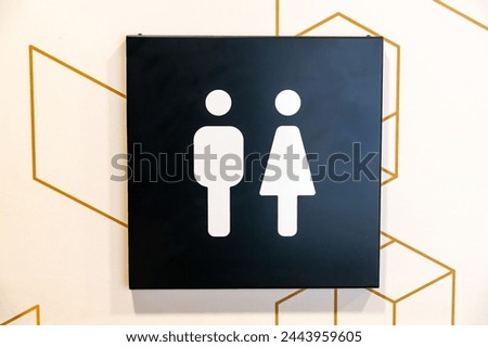 Bautzen, Saxony - Germany - 04-10-2021: Restroom sign with male and female symbols against a hexagonal backdrop