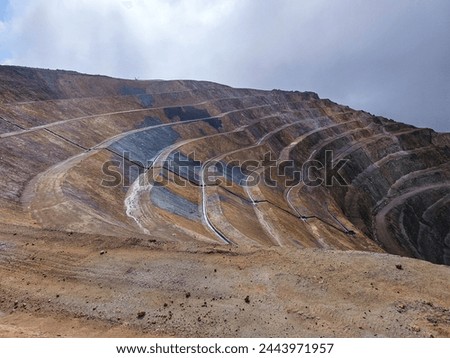 
OPEN PIT MINE WITH GEOSYNTHETIC DINS Royalty-Free Stock Photo #2443971957