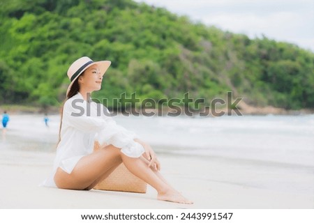 Portrait beautiful young asian woman relax smile around beach sea ocean in holiday vacation travel trip