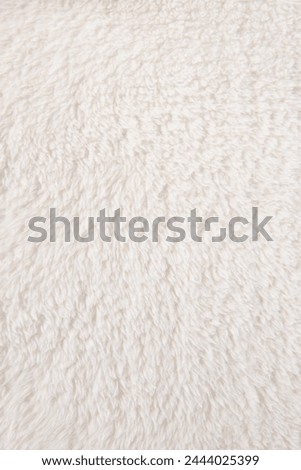 white plush fabric texture background, background pattern of soft warm material Royalty-Free Stock Photo #2444025399