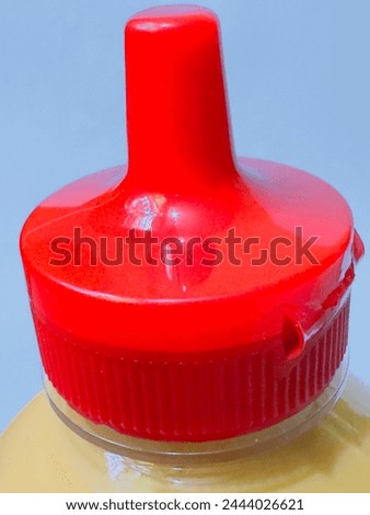 A red coloured bottle cap to save goods. Royalty-Free Stock Photo #2444026621