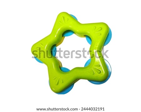Picture of green star shaped plastic baby tambourine isolated
