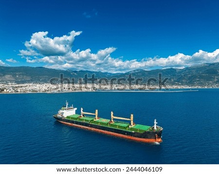 Aerial drone photo of huge bulk carrier tanker anchored in deep blue Aegean sea