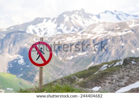 Sign of the pedestrian entrance was forbidden mountains in the background.
