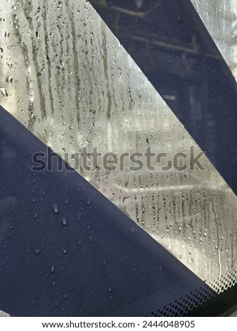 The vibes from inside Transjakarta when it rains Royalty-Free Stock Photo #2444048905