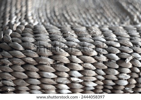 From the raw material of water hyacinth, various crafts can be produced such as bags, sandals, souvenirs, food hoods, cellphone pouches, cars and also various functional items such as tables and chair Royalty-Free Stock Photo #2444058397