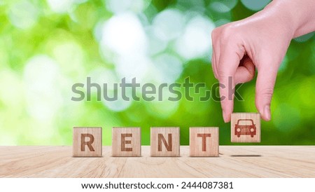 Vehicle, transportation investment and car mortgage financial concept. wood cube block with RENT word, and icon car. Concept of Rent a car.