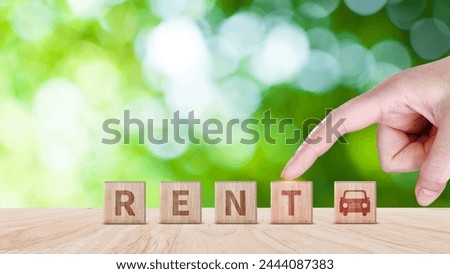 Vehicle, transportation investment and car mortgage financial concept. wood cube block with RENT word, and icon car. Concept of Rent a car.