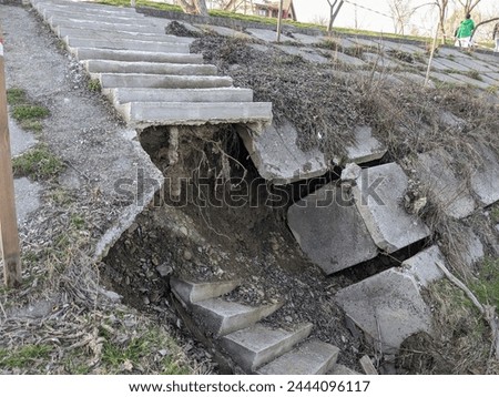 Collapse of a staircase on a dam, a dam near a river in spring. High quality photo