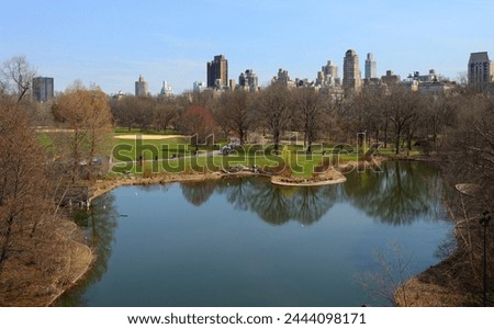 Great Lawn and Turtle Pond in spring. Central Park in Manhattan, New York City, United States Royalty-Free Stock Photo #2444098171