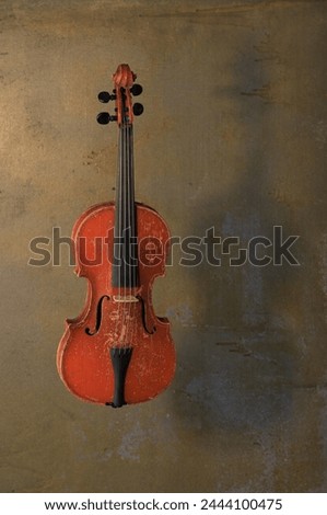 old violin on concrete background