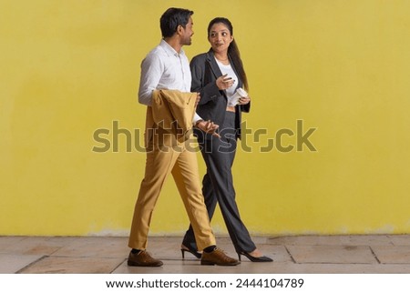 Portrait of office colleagues talking to each other Royalty-Free Stock Photo #2444104789