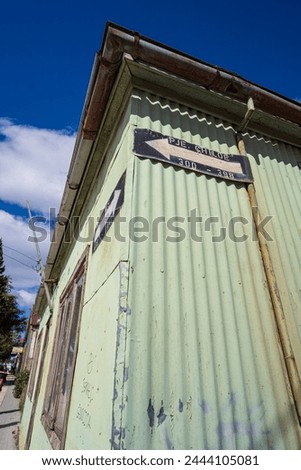 One way sign on house in Puerto Natales, Chile