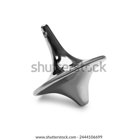 One silver spinning top on white background Royalty-Free Stock Photo #2444106699