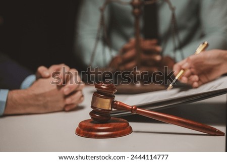 A group of lawyers and clients are discussing the contract they will be signing together in the future, Collaborative brainstorming between lawyers and clients Royalty-Free Stock Photo #2444114777