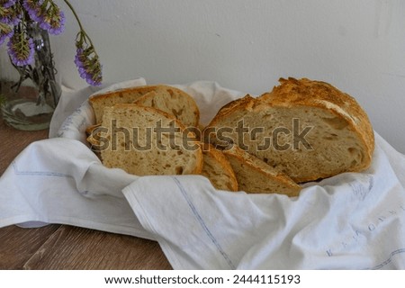 Sliced ​​bread consisting of assorted slices of white and whole wheat flour in a bread bin, high angle view 1