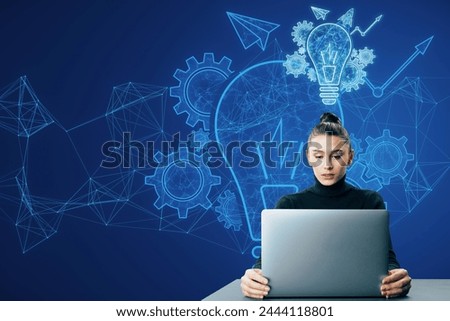 Attractive thoughtful young businesswoman using laptop at desk with glowing blue lightbulb, cogwheel and arrow hologram on polygonal background. Innovation and creative idea concept