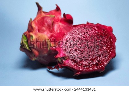 red dragon fruit isolated on blue background