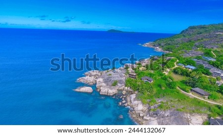 Felicite Island, close to La Digue, Seychelles. Aerial view of tropical coastline on a sunny day. Royalty-Free Stock Photo #2444132067