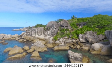 Felicite Island, close to La Digue, Seychelles. Aerial view of tropical coastline on a sunny day. Royalty-Free Stock Photo #2444132117