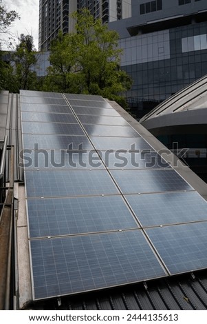 Top view Solar Panels. Solar photo voltaic panels system power or Solar Cell on industrial building roof for producing green ecological electricity. Production of renewable energy