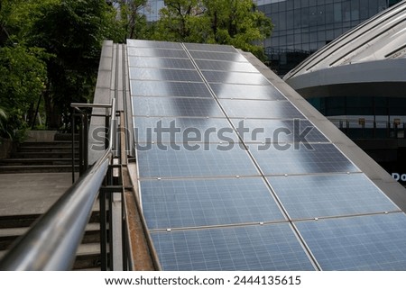 Top view Solar Panels. Solar photo voltaic panels system power or Solar Cell on industrial building roof for producing green ecological electricity. Production of renewable energy