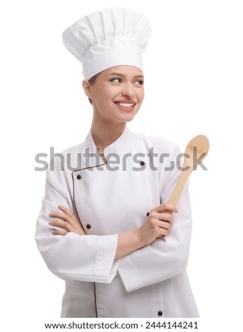 Happy chef in uniform holding wooden spoon on white background