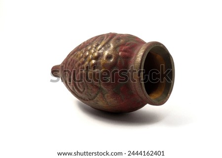 Souvenir Qvevri (Kvevri) made of clay for drinking wine. Bas-reliefs in the form of a grapevine. Kvevri are earthenware vessels used for 
the fermentation, storage and ageing of Georgian wine. Royalty-Free Stock Photo #2444162401