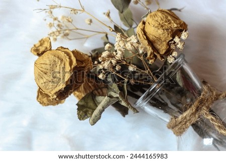 A bouquet of flowers that have dried, deliberately kept to commemorate beautiful memories