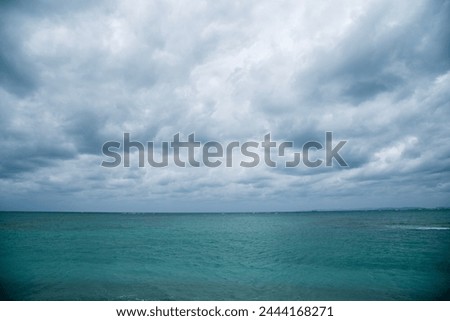 Stormy clouds over the blue ocean