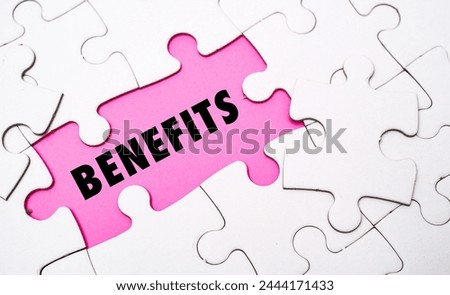 BENEFITS word alphabet letters on puzzle as a background