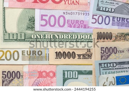 American dollar with Euro, Chinese yuan, Japanese yen money as finance background. World currency