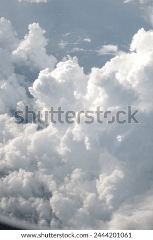 Exterior photo visual view of large cloudscape cloud clouds like cumulus cumulonimbus in the sky white nice ffluffy cotton resh wether view from aerial altitude Royalty-Free Stock Photo #2444201061
